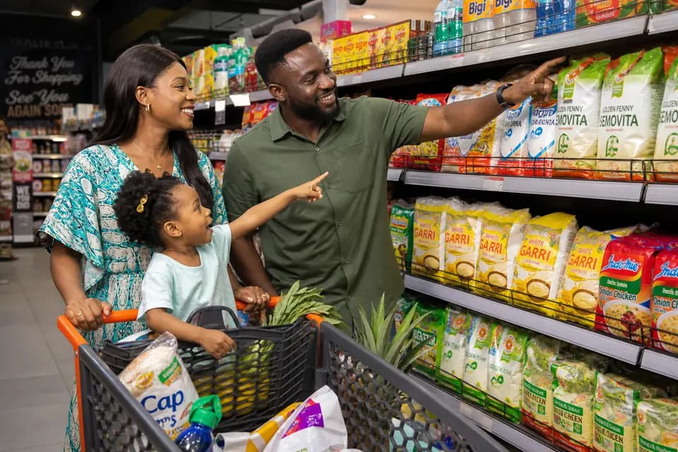 Nigerian family shopping for groceries in a supermarket